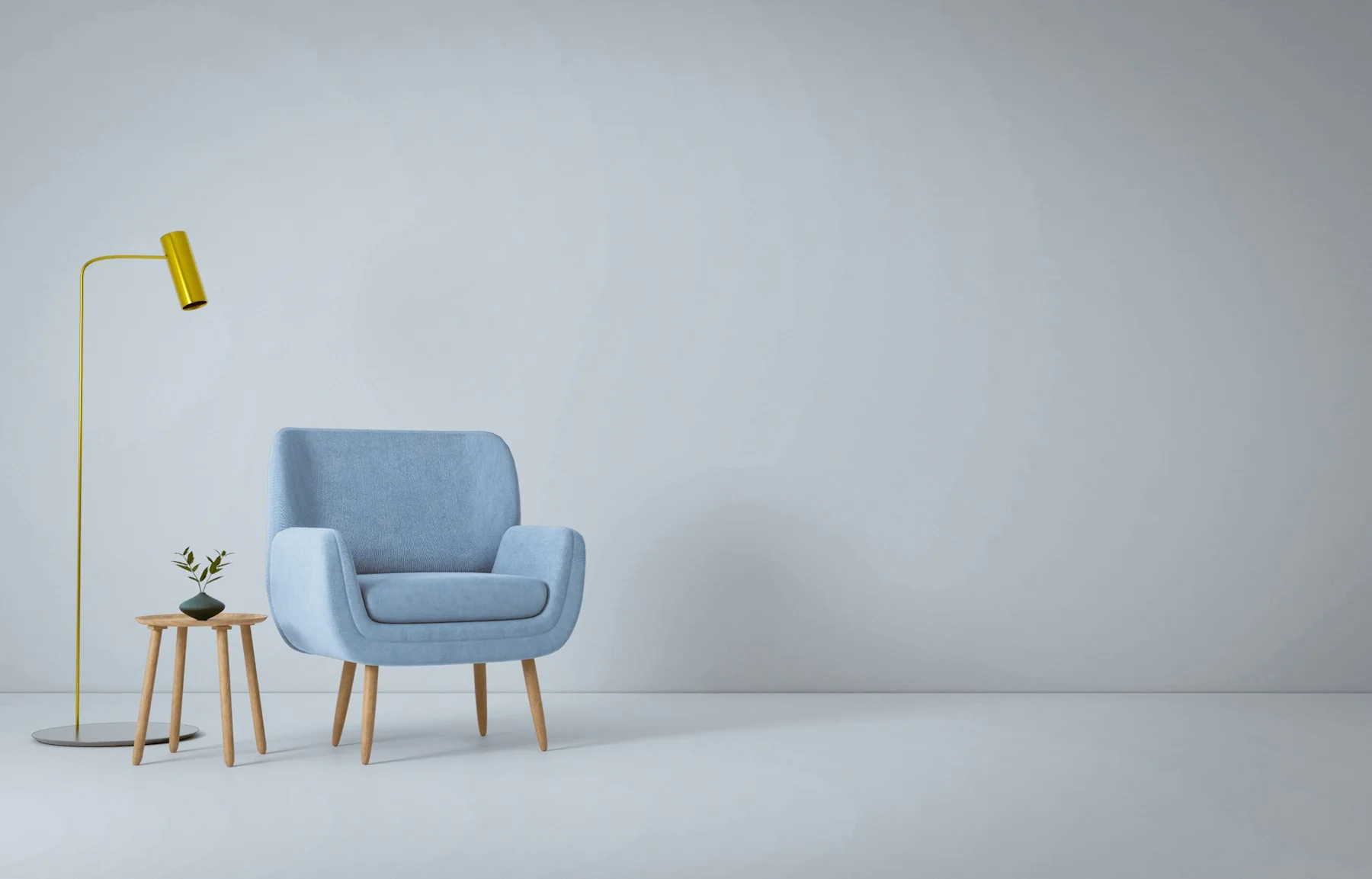 A blue armchair and yellow lamp in a sunlit room